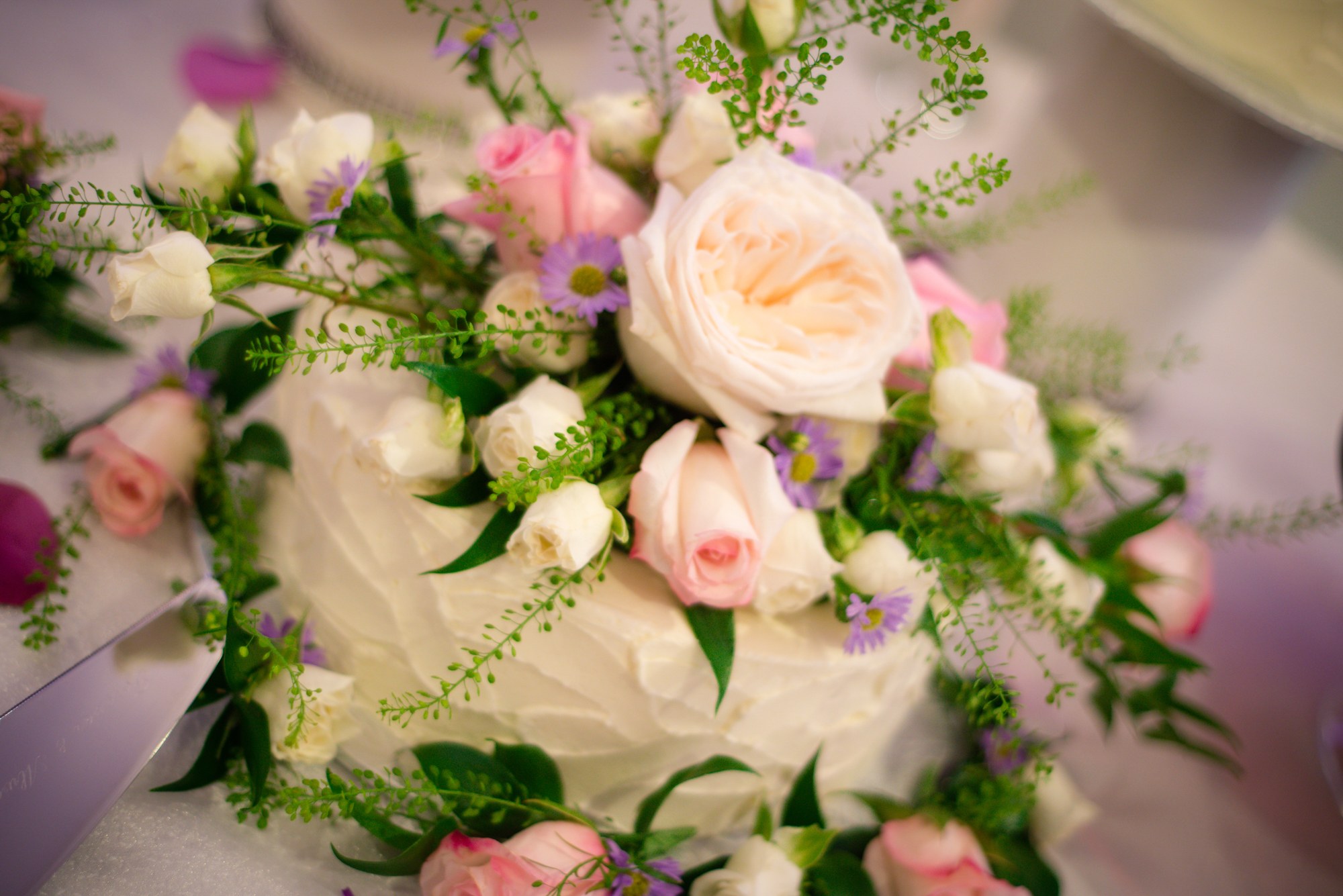 A bouquet of pale roses and purple flowers