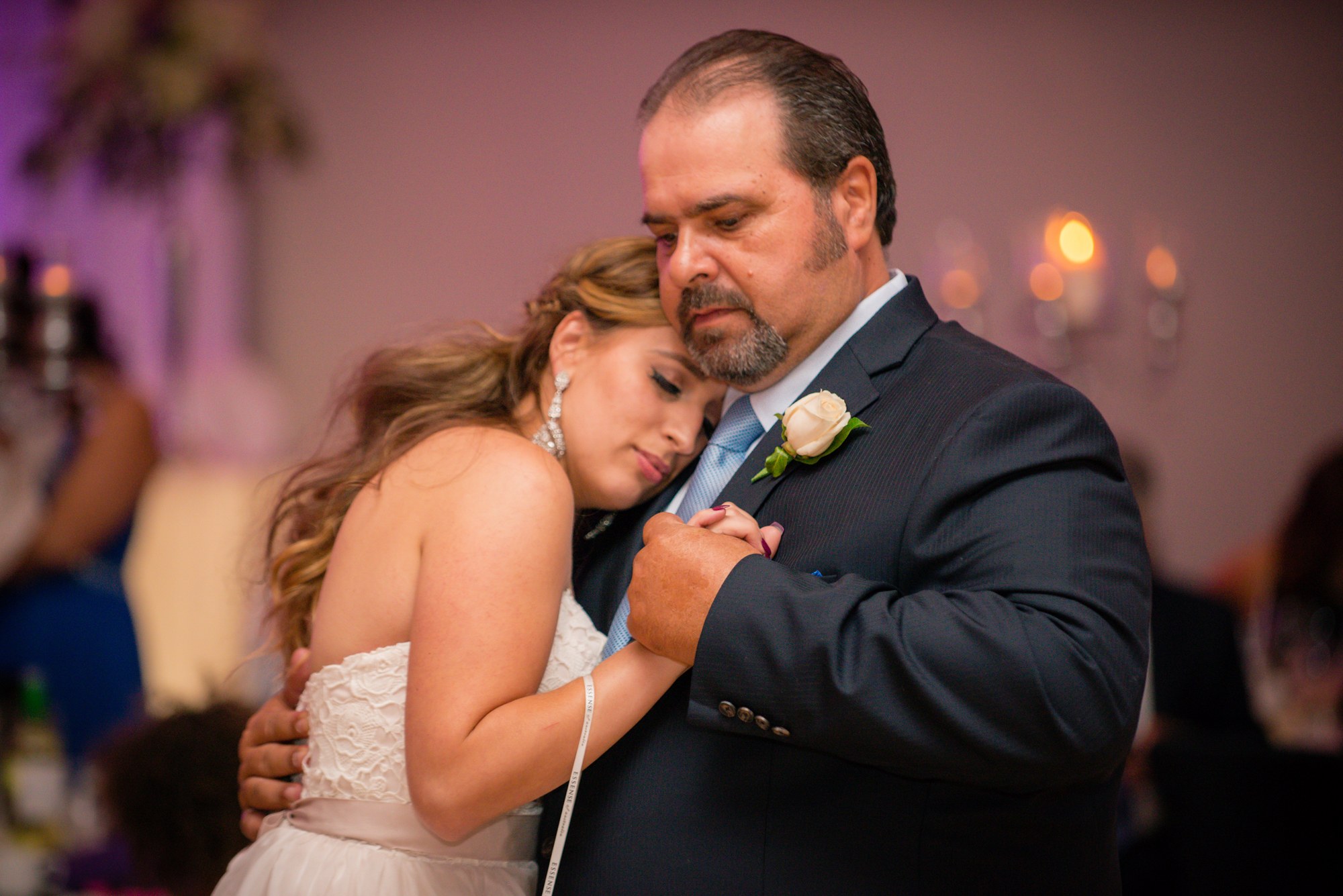 An emotional embrace during a reception dance