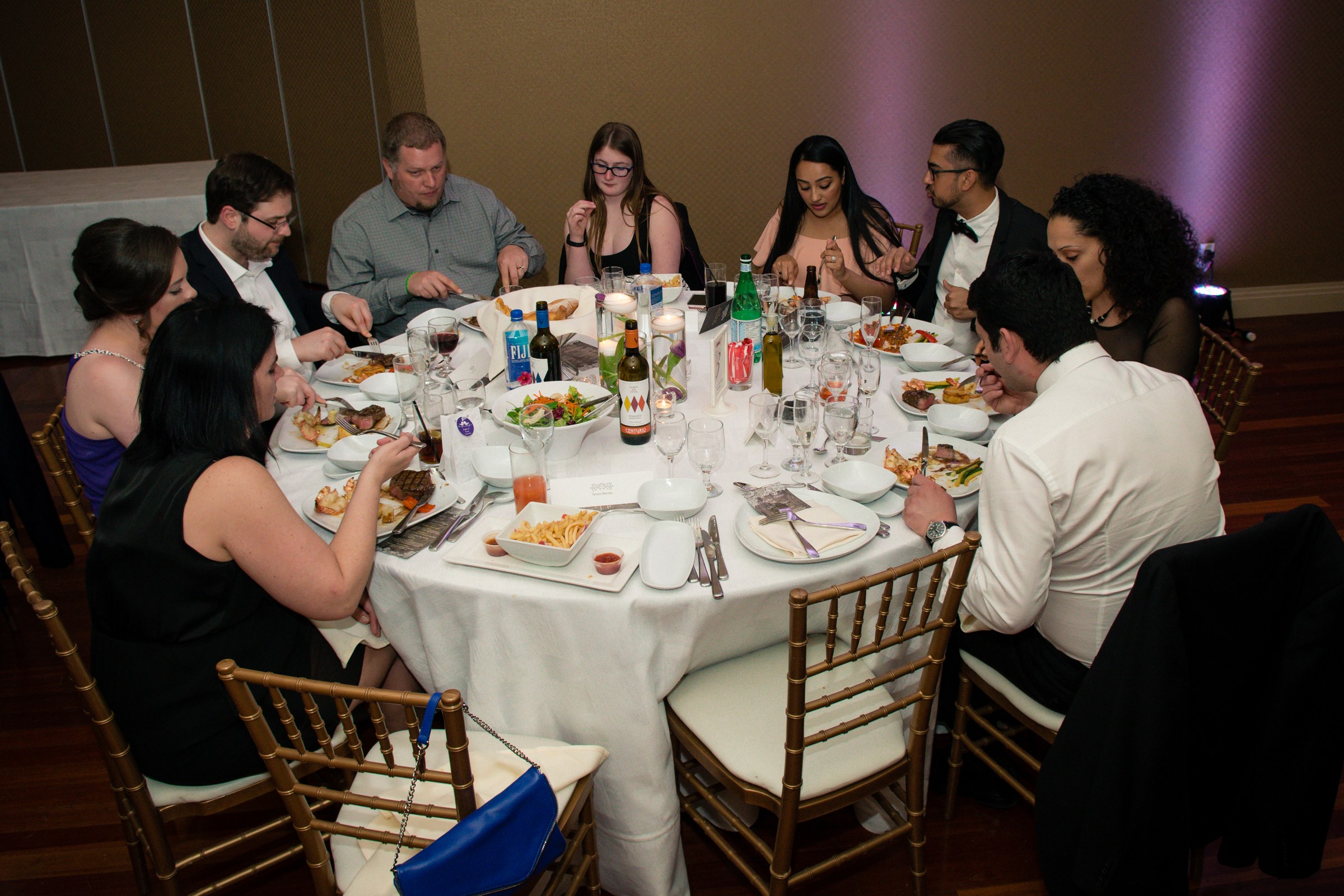 Wedding guests enjoying dinner together