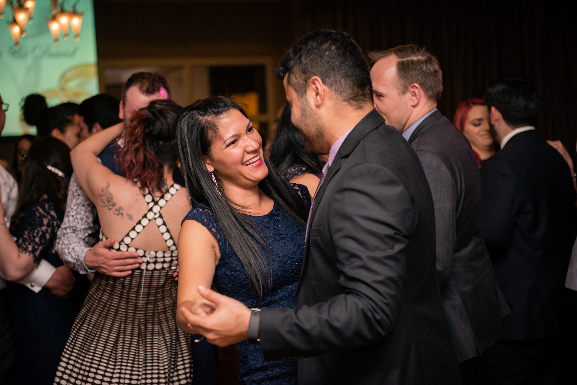 Guests laughing together on the dance floor