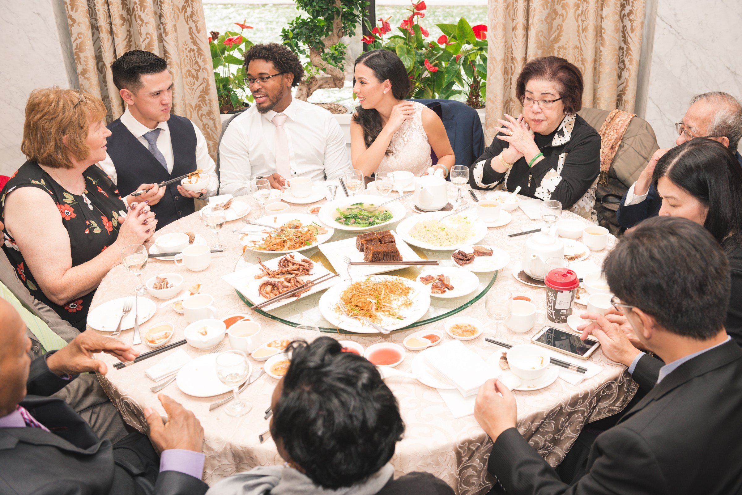Family and guests sharing a celebratory meal