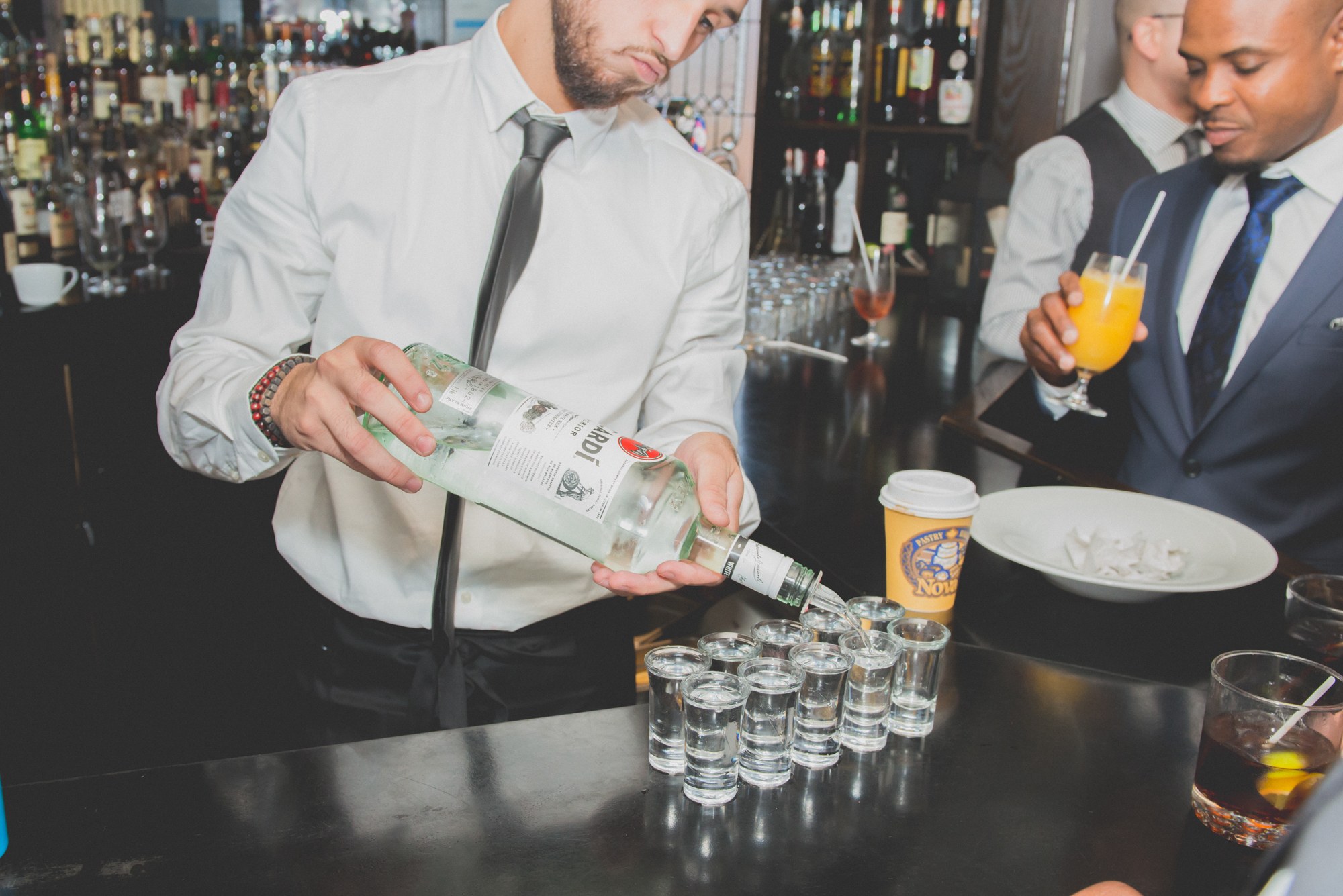 Drinks being poured before a wedding toast