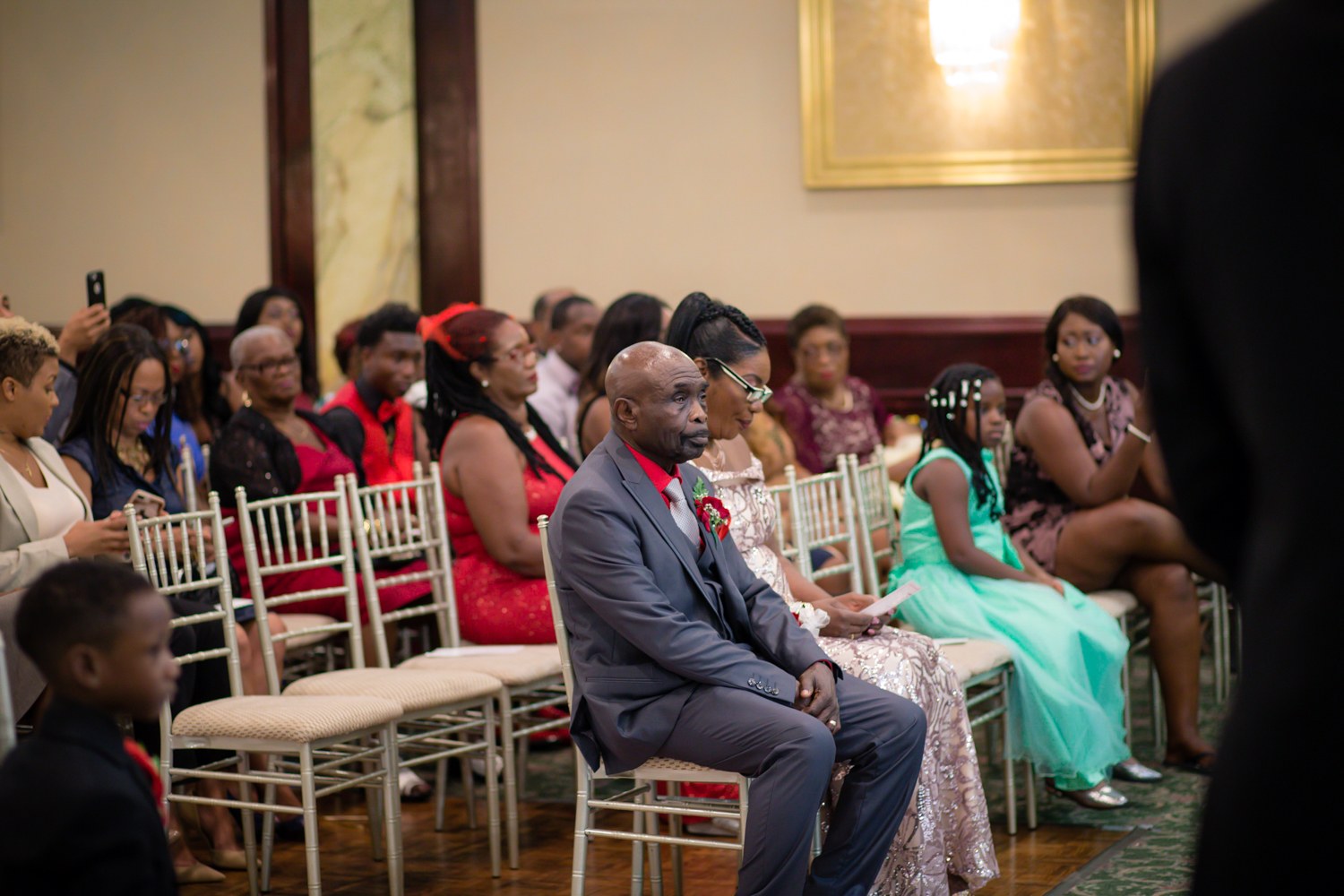 Guests watching the wedding ceremony
