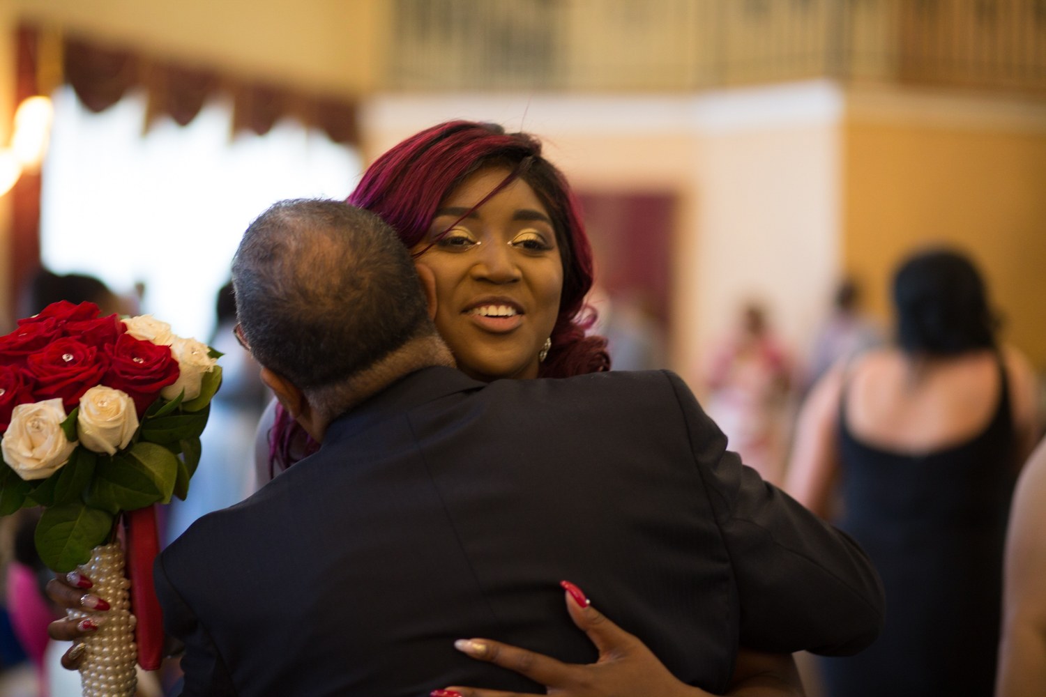 Bride embracing a guest after the ceremony
