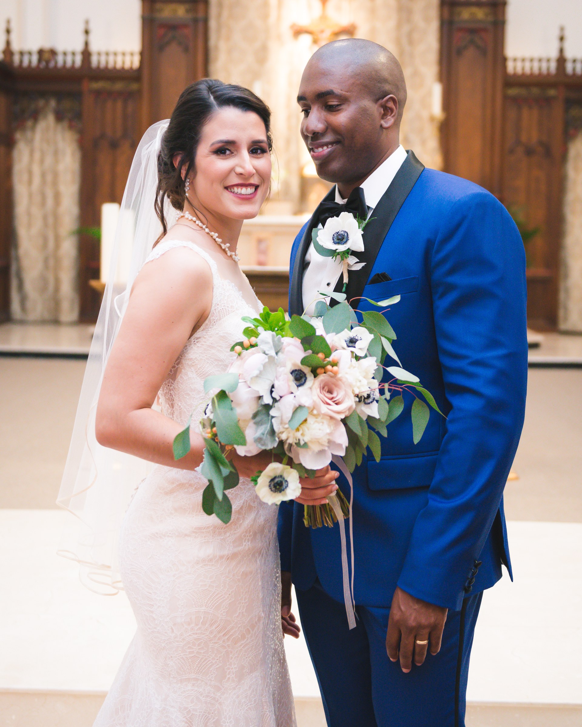 Couple together inside a church after their ceremony
