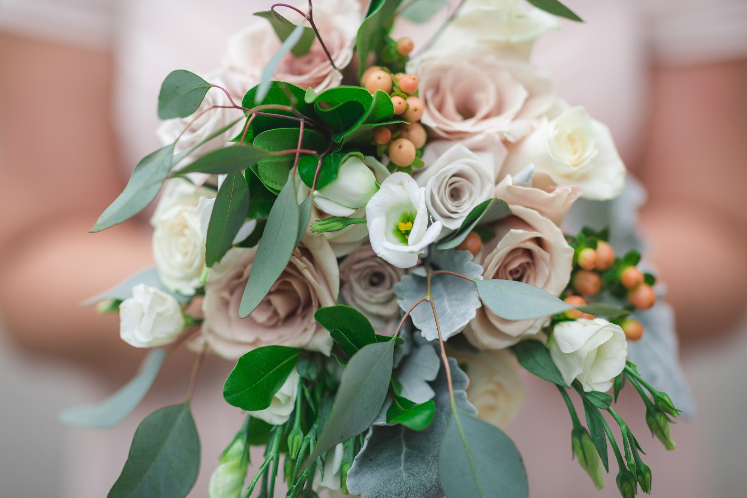 White and blush roses in a bridal bouquet